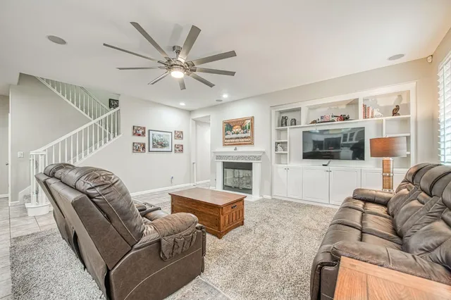 a kitchen with a sink a counter top space cabinets and stainless steel appliances