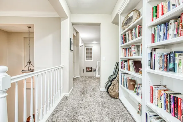 a bedroom with a bed couch and window