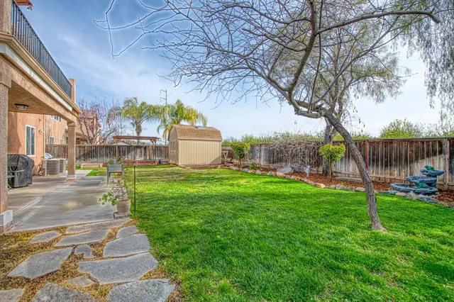 an aerial view of a house with a lake view