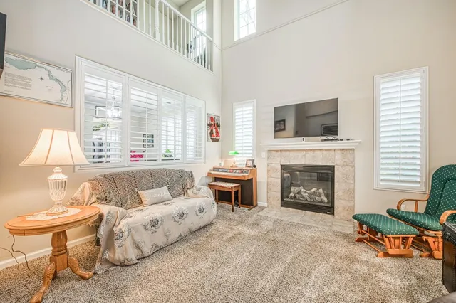 a bedroom with furniture and a window