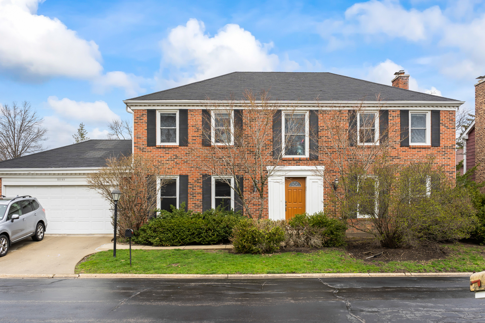 2849 Farmington Road Northbrook, IL 60062 - Photo 1 of 32 a front view of a house with a garden