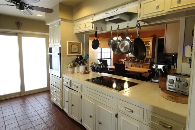 a kitchen with a sink and cabinets