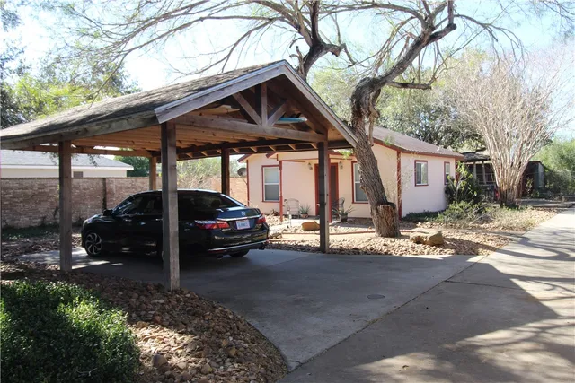 a view of a car parked in front of a house