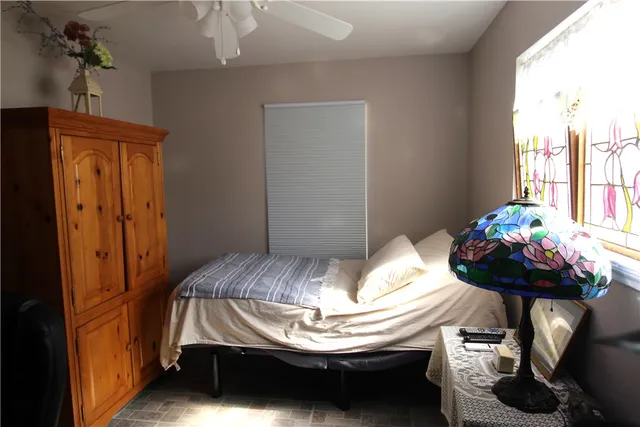 a bedroom with a bed and a table