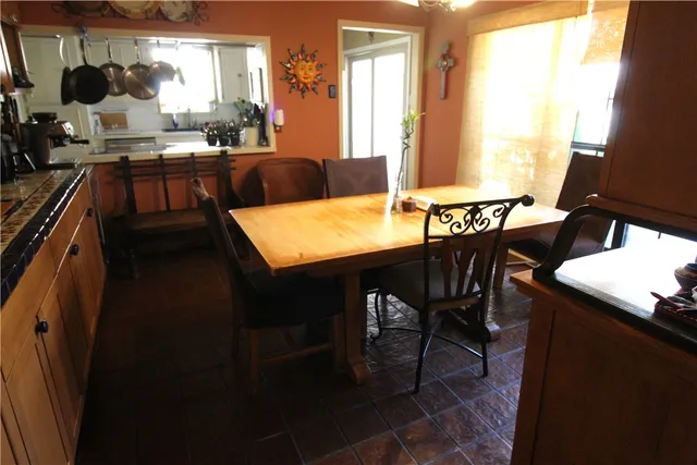 a view of a dining room with furniture and window