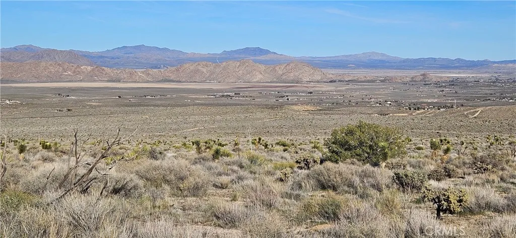 a view of an ocean and a mountain