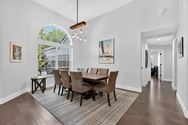 a bedroom with a bed window and a flat screen tv