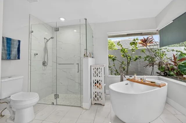 a view of a house with backyard porch and sitting area