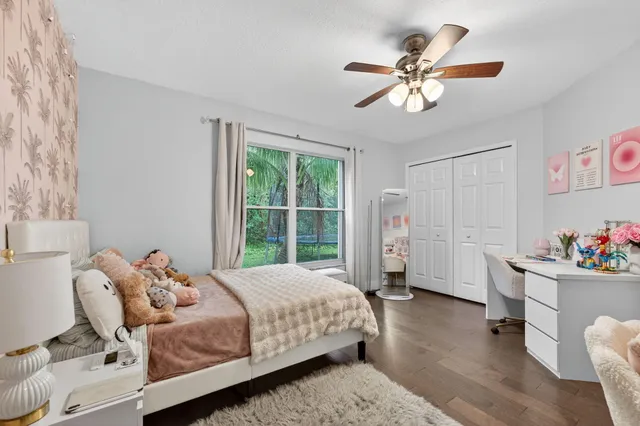 an aerial view of a house with outdoor space and lake view