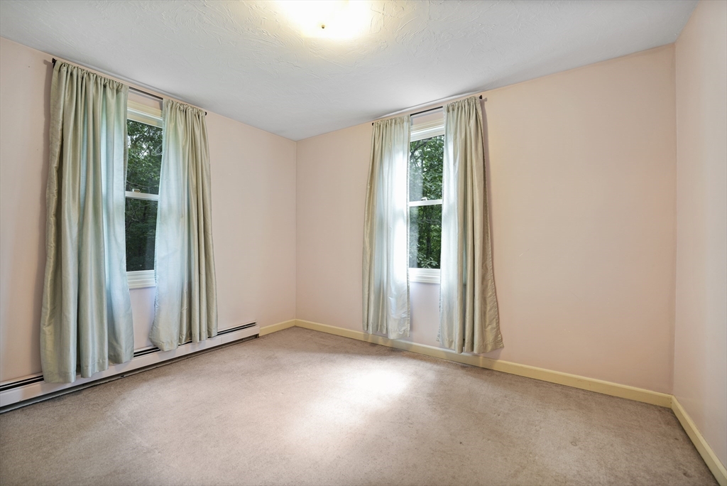 24 Springwood Drive Rochester, MA 02770 - Photo 16 of 21 an empty room with windows