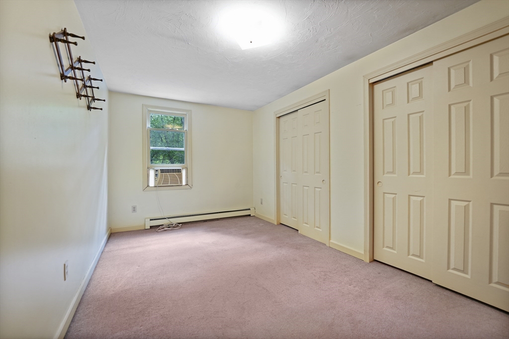 24 Springwood Drive Rochester, MA 02770 - Photo 17 of 21 an empty room with windows