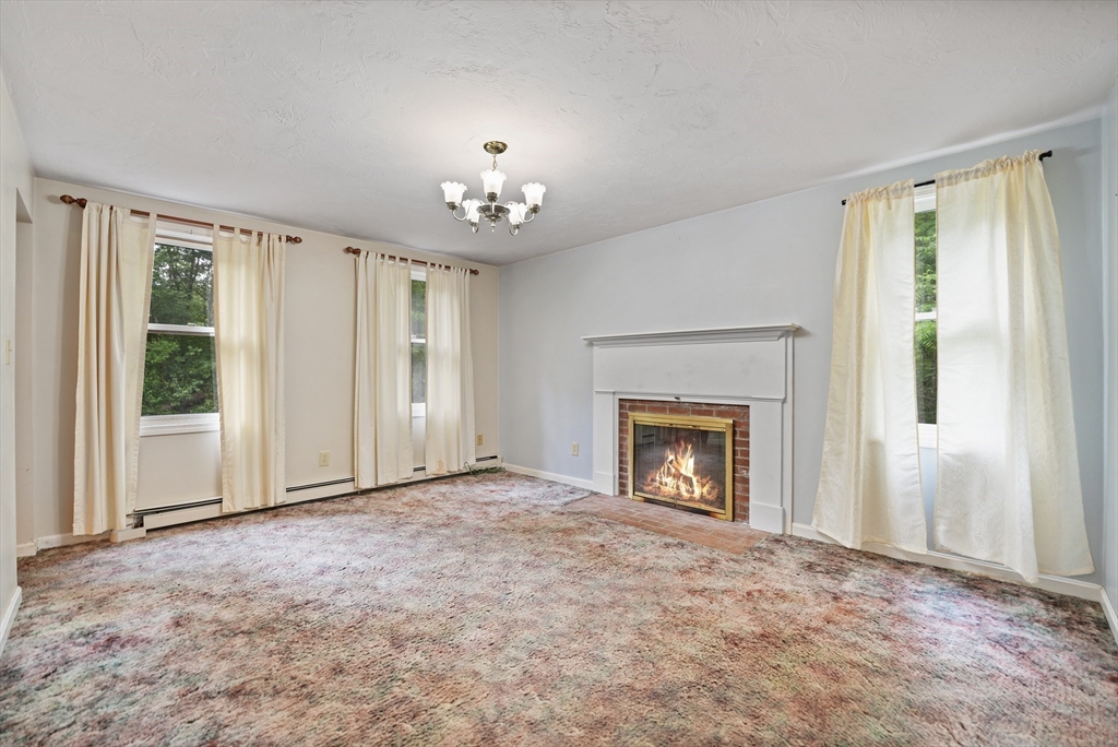 24 Springwood Drive Rochester, MA 02770 - Photo 4 of 21 a view of an empty room with a window