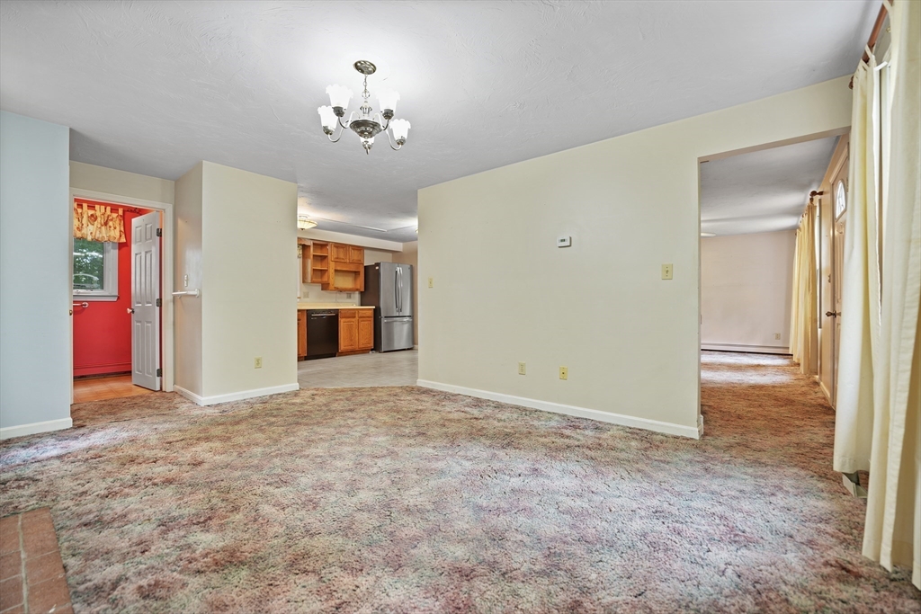 24 Springwood Drive Rochester, MA 02770 - Photo 6 of 21 a view of an empty room with a window
