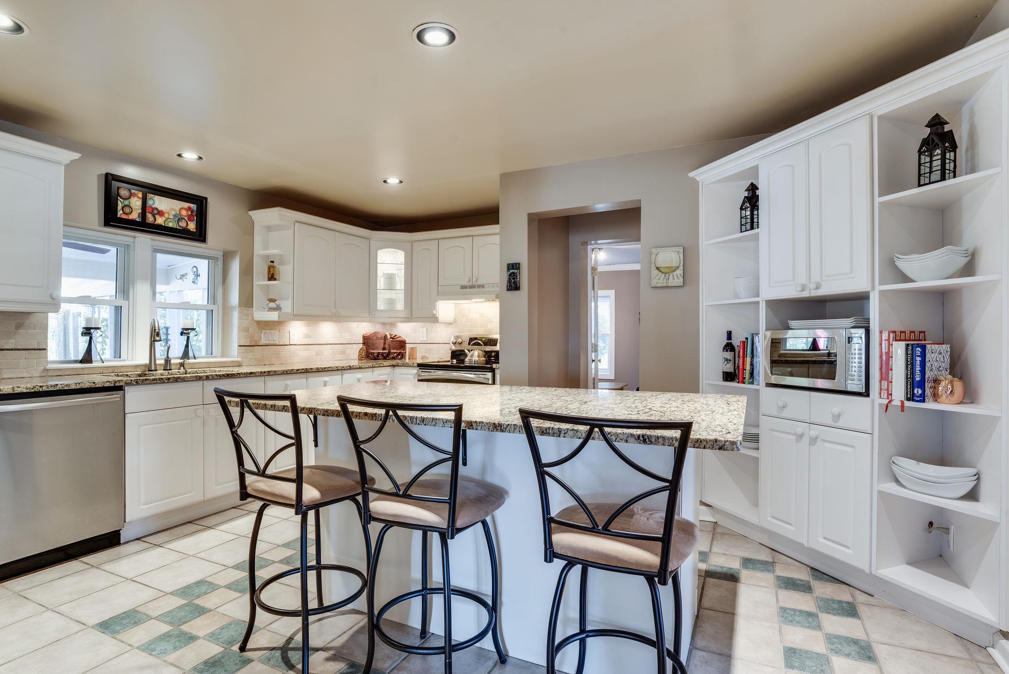 4133 Arno Road Franklin, TN 37064 - Photo 11 of 30 a kitchen with a table chairs refrigerator and cabinets