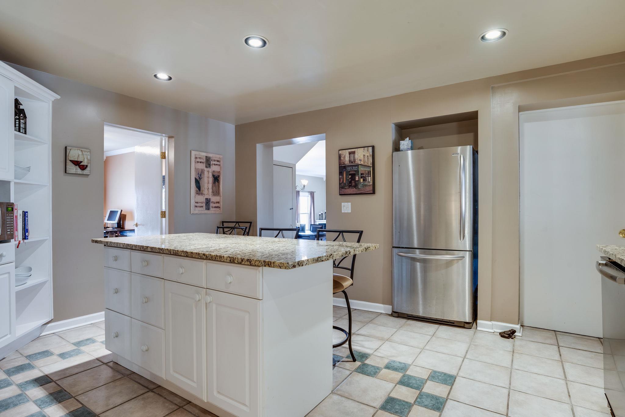 4133 Arno Road Franklin, TN 37064 - Photo 13 of 30 a kitchen with a refrigerator sink and cabinets