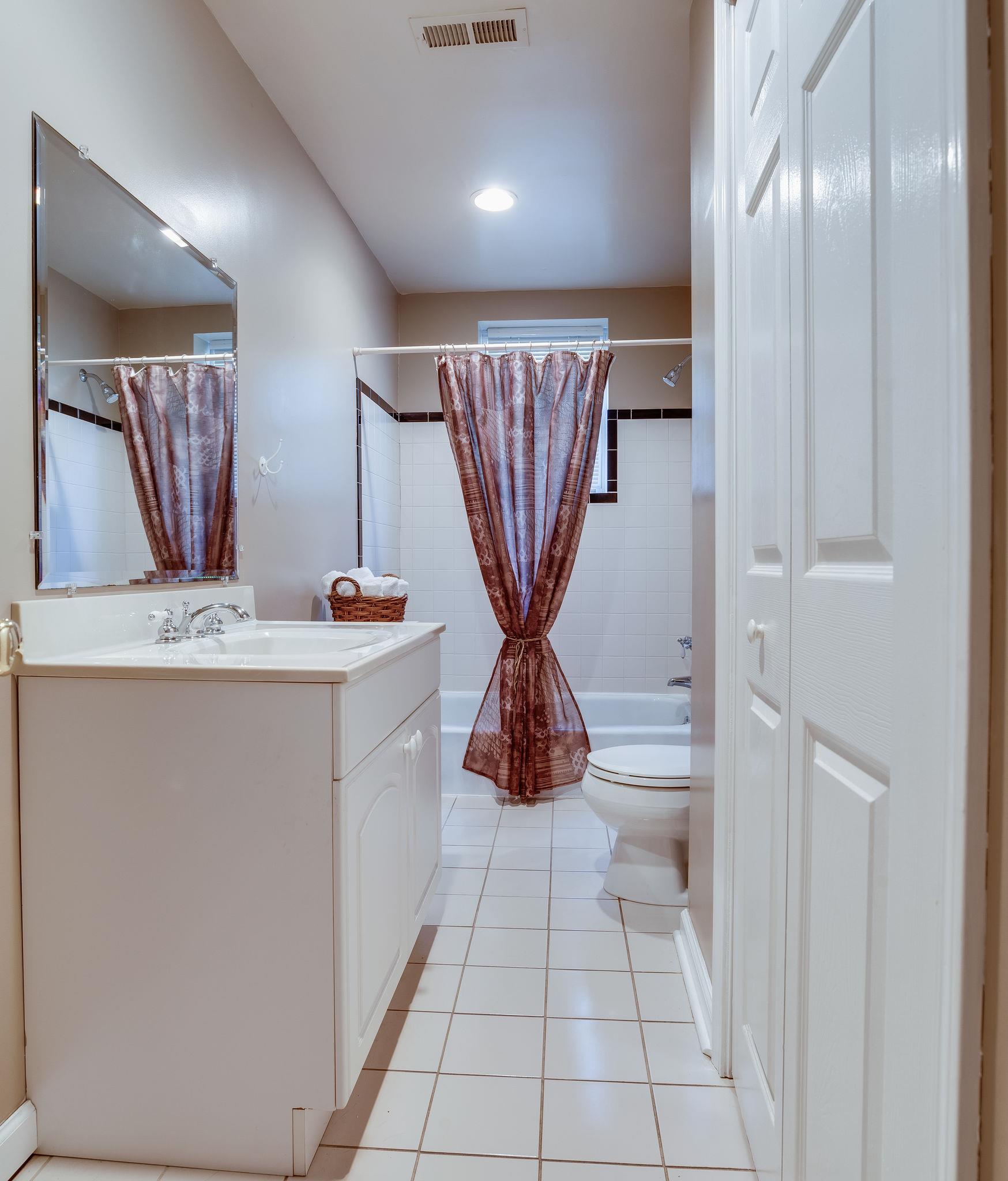 4133 Arno Road Franklin, TN 37064 - Photo 18 of 30 a bathroom with a sink a toilet and shower
