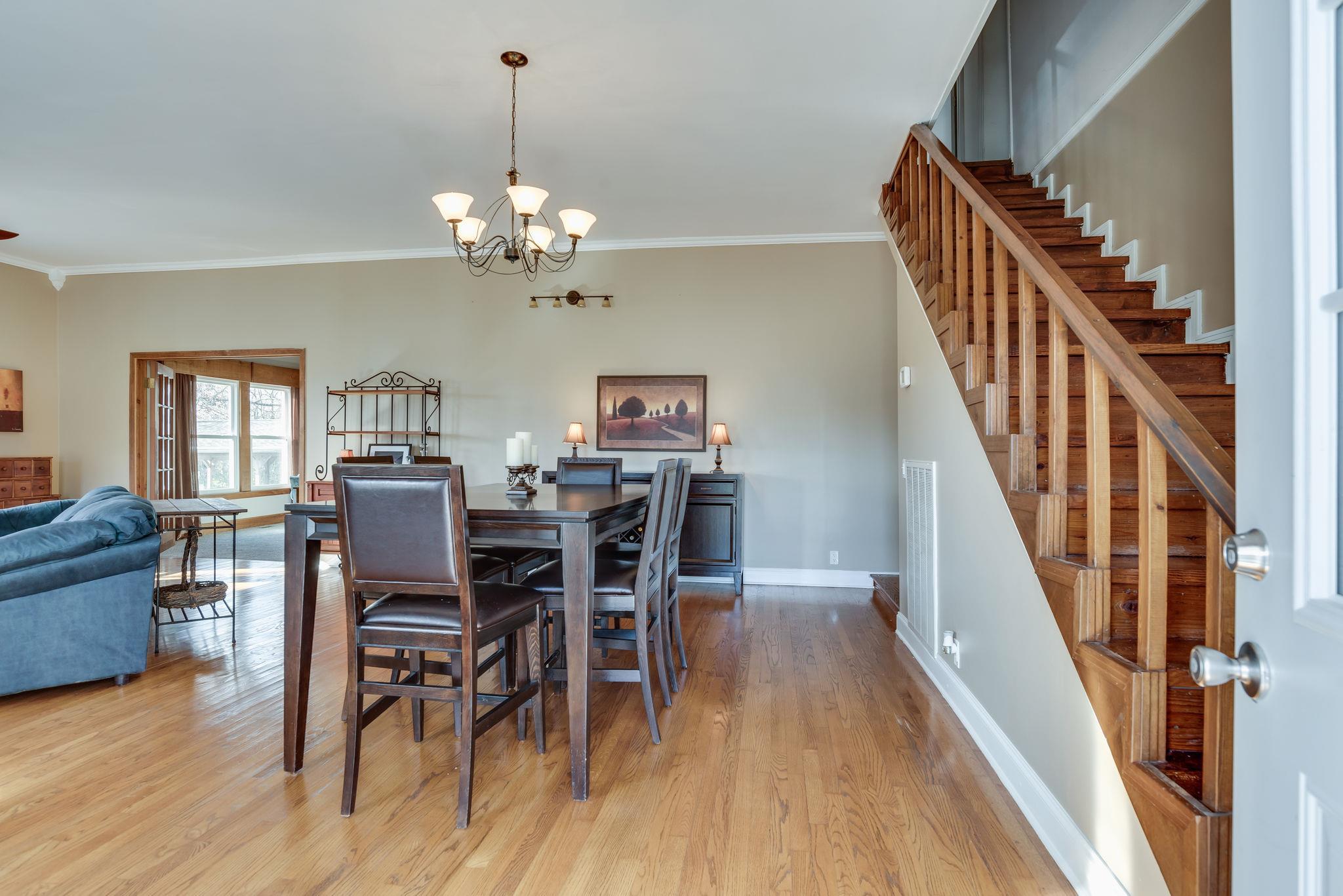 4133 Arno Road Franklin, TN 37064 - Photo 3 of 30 a view of a dining room with furniture and wooden floor