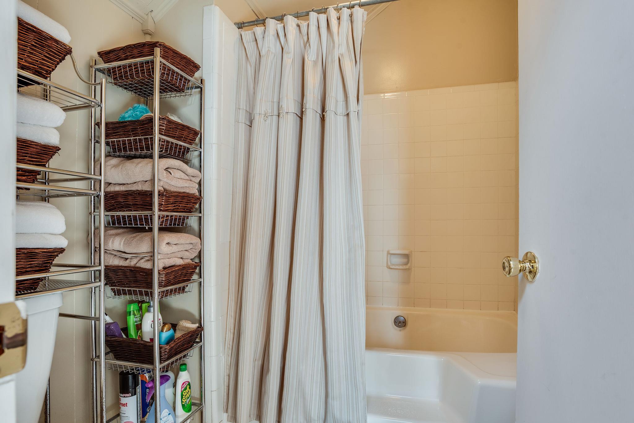 4133 Arno Road Franklin, TN 37064 - Photo 25 of 30 a view of walk in closet with clothes and shoes