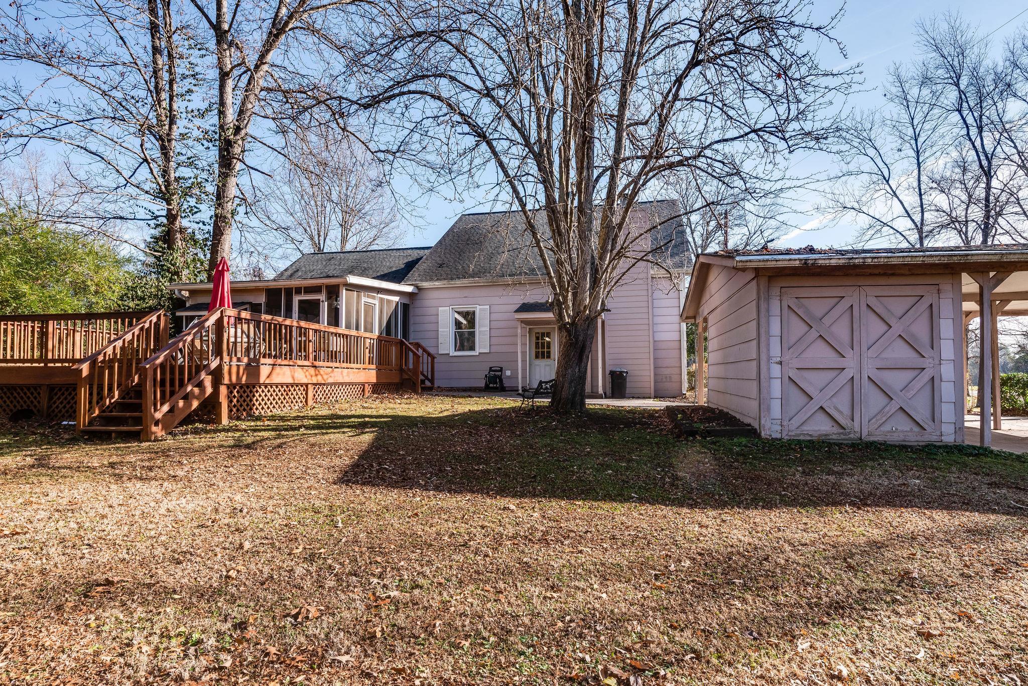 4133 Arno Road Franklin, TN 37064 - Photo 29 of 30 a view of a white house with a large tree in front of it