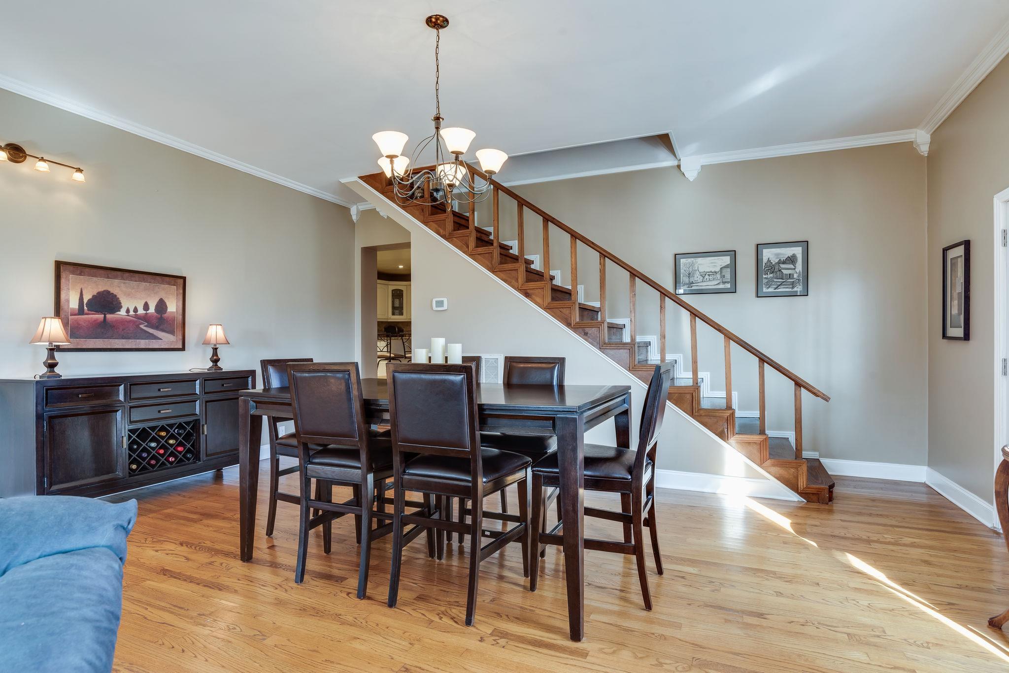 4133 Arno Road Franklin, TN 37064 - Photo 5 of 30 a view of a dining area with furniture wooden floor and chandelier