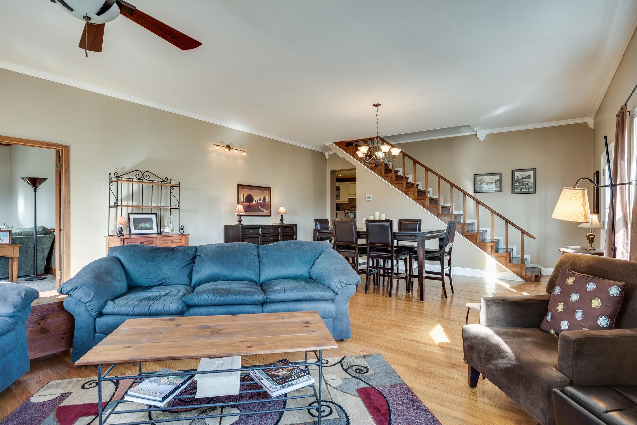 4133 Arno Road Franklin, TN 37064 - Photo 7 of 30 a living room with furniture and a dining table with wooden floor