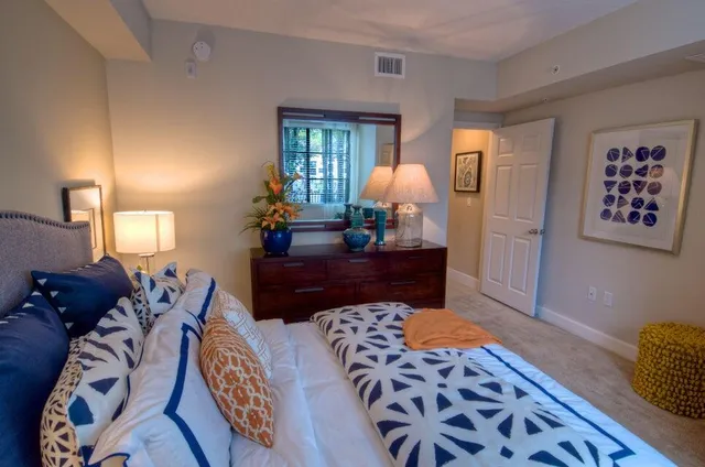 a living room with furniture and a lamp