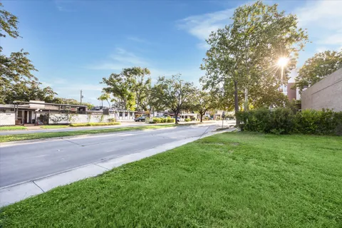 a view of outdoor space with garden and trees