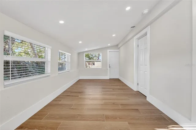 a view of an empty room with a window