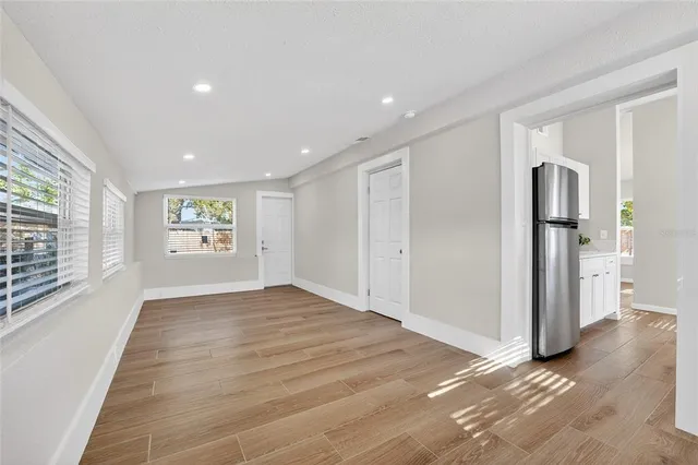 a view of an empty room with a window