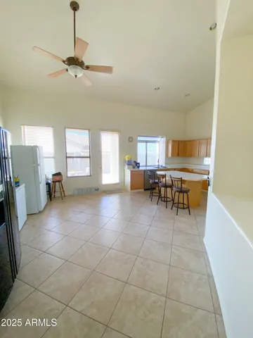 a view of a livingroom with furniture and a window