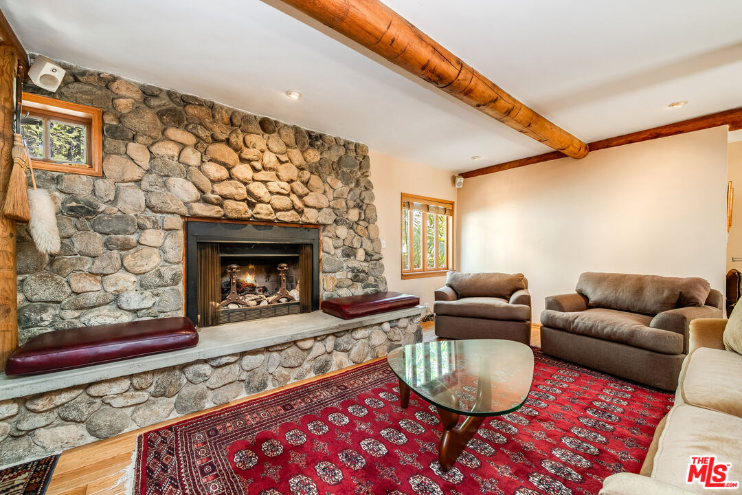 454 East Rustic Road Santa Monica, CA 90402 - Photo 11 of 34 a living room with furniture and a fireplace