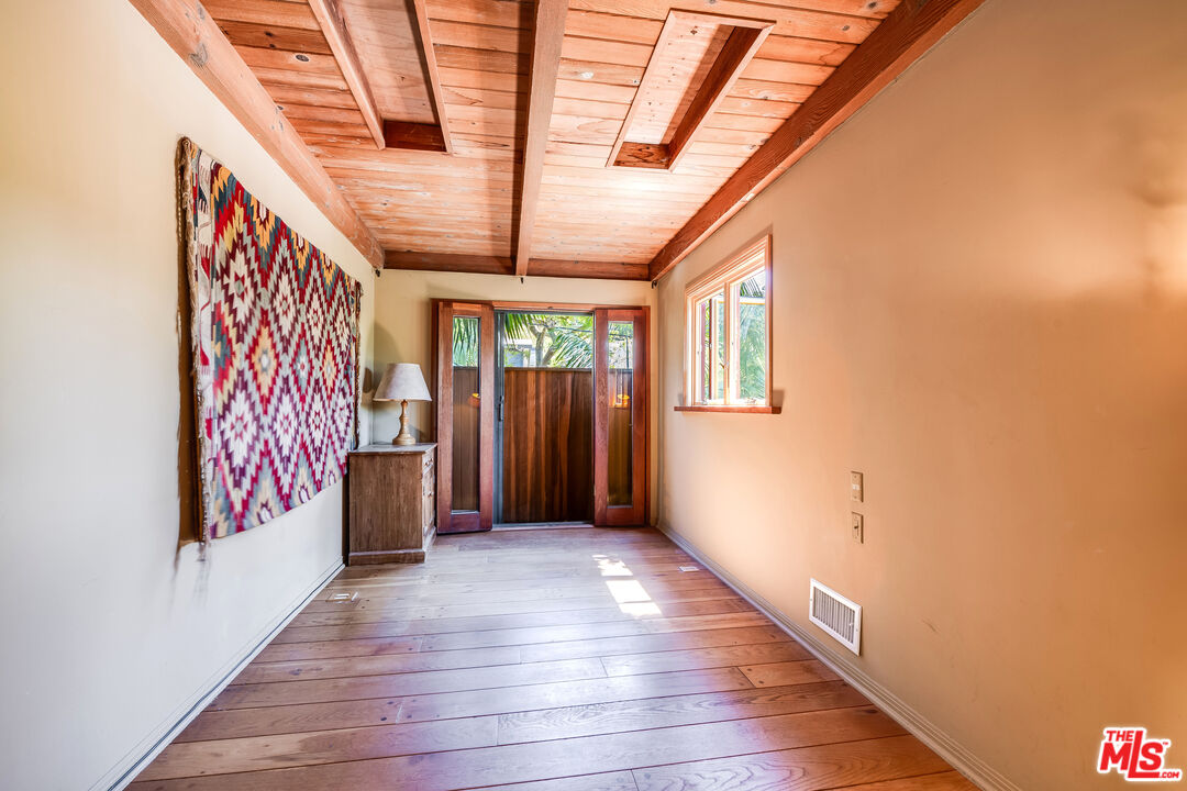 454 East Rustic Road Santa Monica, CA 90402 - Photo 23 of 34 a view of hallway with stairs and wooden floor