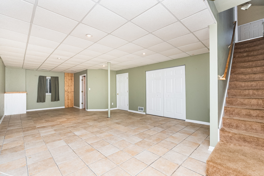 611 Chestnut Drive Oswego, IL 60543 - Photo 11 of 15 a view of an empty room with wooden floor