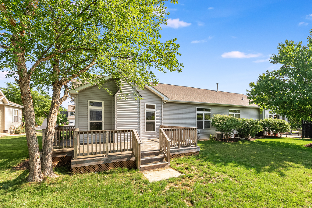 611 Chestnut Drive Oswego, IL 60543 - Photo 14 of 15 a front view of a house with a yard