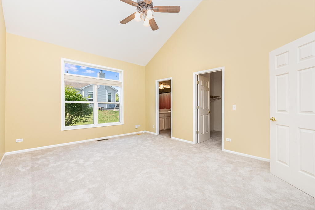 611 Chestnut Drive Oswego, IL 60543 - Photo 8 of 15 a view of an empty room with a window