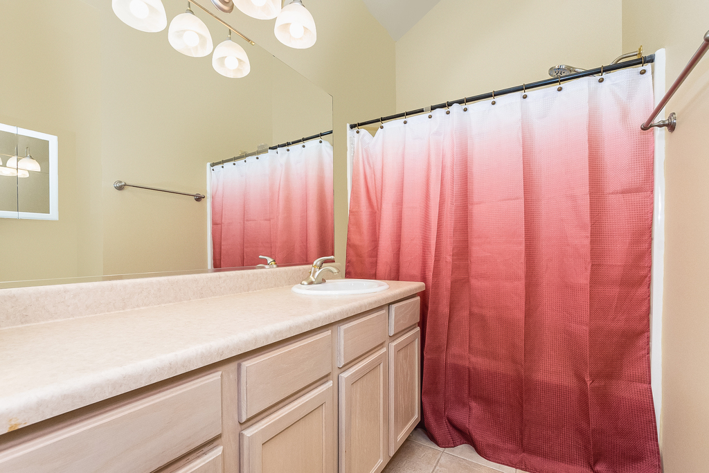 611 Chestnut Drive Oswego, IL 60543 - Photo 9 of 15 a bathroom with a sink and a mirror
