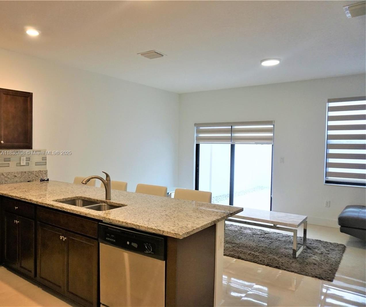 10498 West 33rd Way Hialeah, FL 33018 - Photo 16 of 28 a kitchen with a sink and cabinets