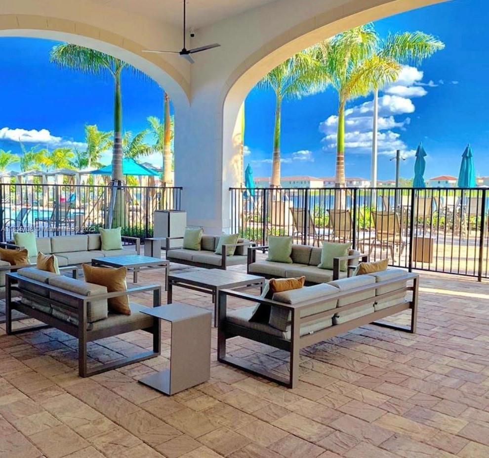 10498 West 33rd Way Hialeah, FL 33018 - Photo 27 of 28 a outdoor space with lots of furniture and umbrella