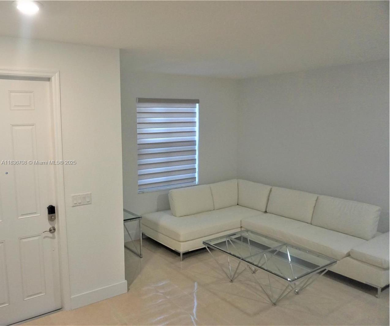 10498 West 33rd Way Hialeah, FL 33018 - Photo 4 of 28 a living room with furniture and a window