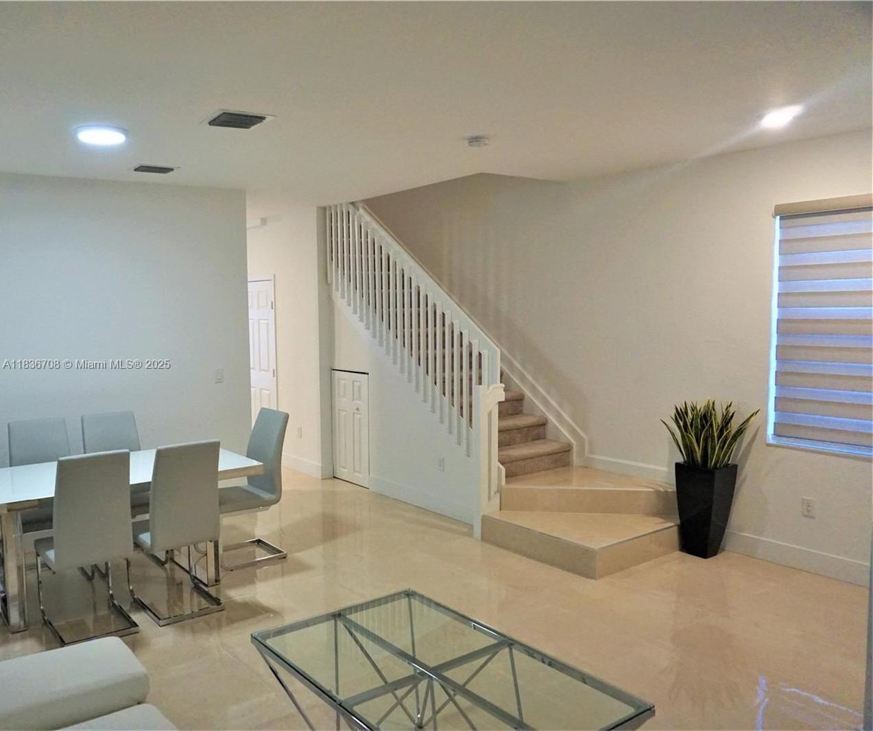 10498 West 33rd Way Hialeah, FL 33018 - Photo 8 of 28 a view of entryway with livingroom and furniture