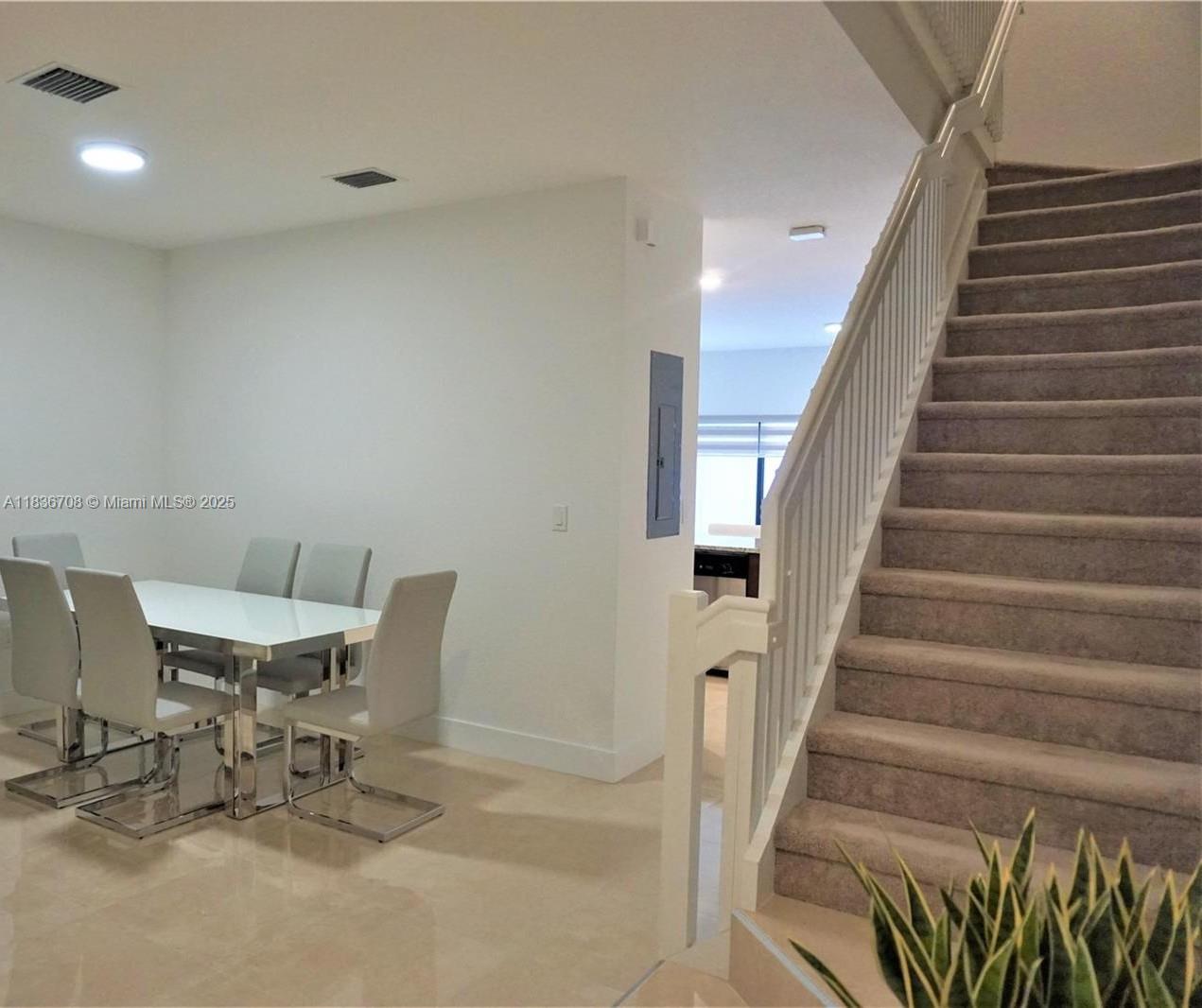 10498 West 33rd Way Hialeah, FL 33018 - Photo 9 of 28 a view of a chairs and table in a room