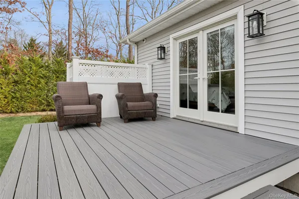 a view of a house with couches wooden floor and a yard with wooden floor
