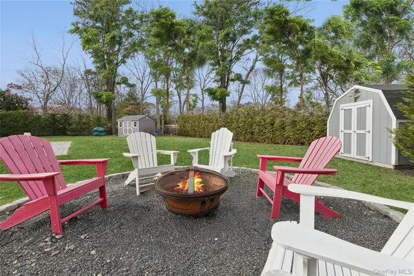 a view of a yard with furniture and outdoor seating