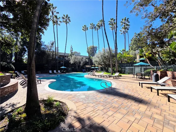 a view of a swimming pool with a patio