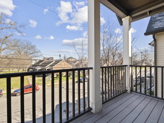 a view of a balcony with wooden floor