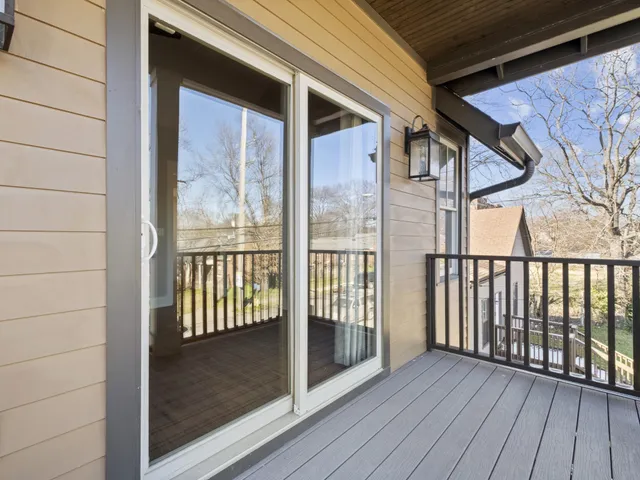 a view of porch with wooden floor