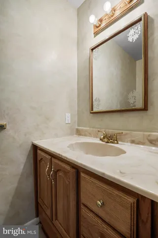 a kitchen with a refrigerator a sink and cabinets