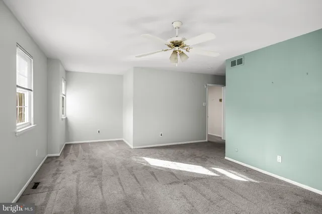 a kitchen with a stove a sink and a cabinets