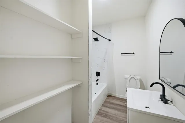 a bathroom with a sink and mirror