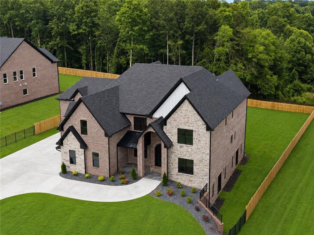 405 Thunder Road Buford, GA 30518 - Photo 5 of 104 a aerial view of a house with roof deck front of house